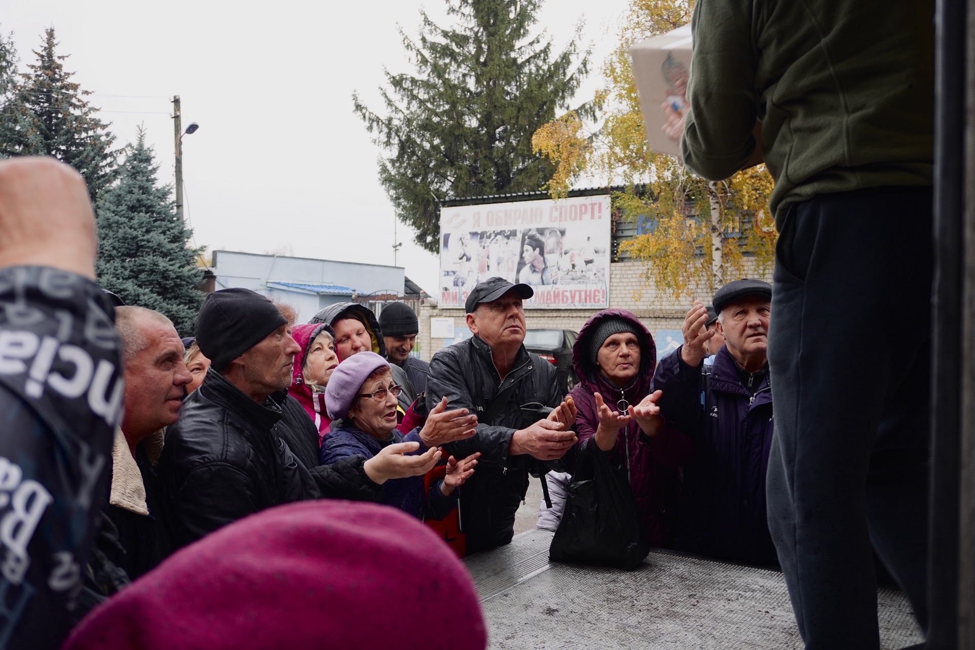 Ukrainian civilians gathered for aid distribution in Kupiansk